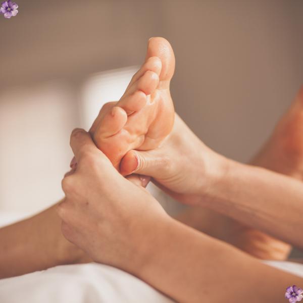 A feet massage with 2 hands.
