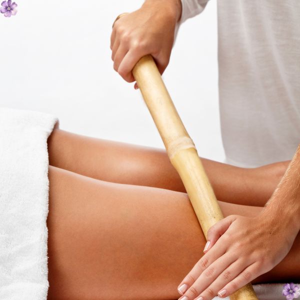 A massage with a bamboo stick on the back.
